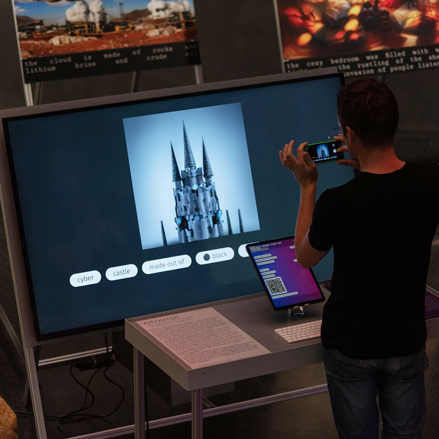 A person infront of a big screen showing an image of a mysterious castle and a tablet with a chatbot application on it